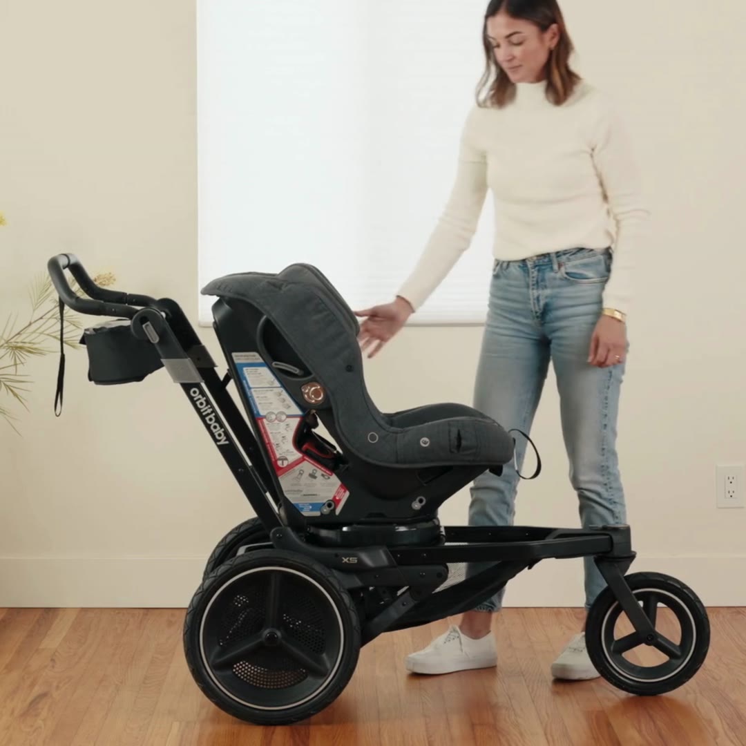 Orbit Baby Toddler Car Seat docked on the X5 Jogging Stroller SmartHub